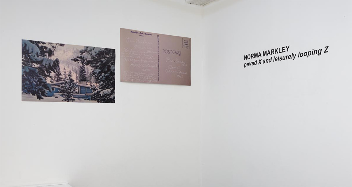Entrance desk area with show title and postcards